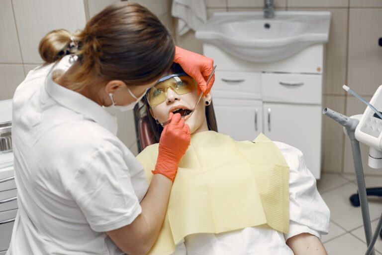 A Dentist Checking a Patient's Teeth