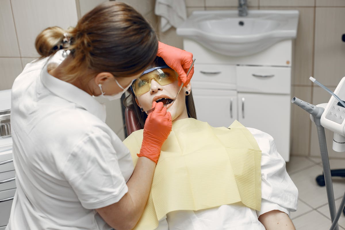 A Dentist Checking a Patient's Teeth