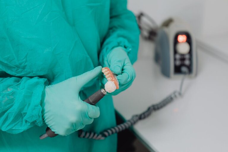 Close Up of Doctor Hands with Denture