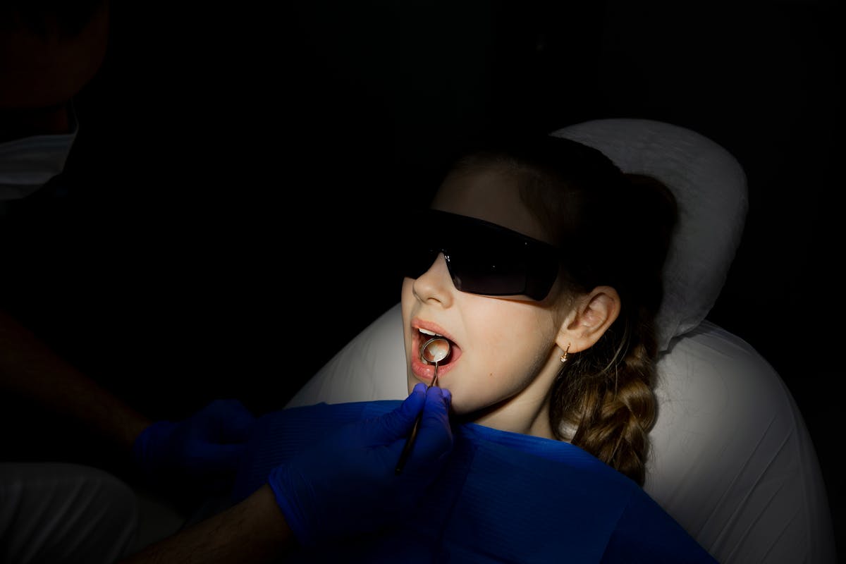 Close Up of Woman in Shadow during Dentist Procedure