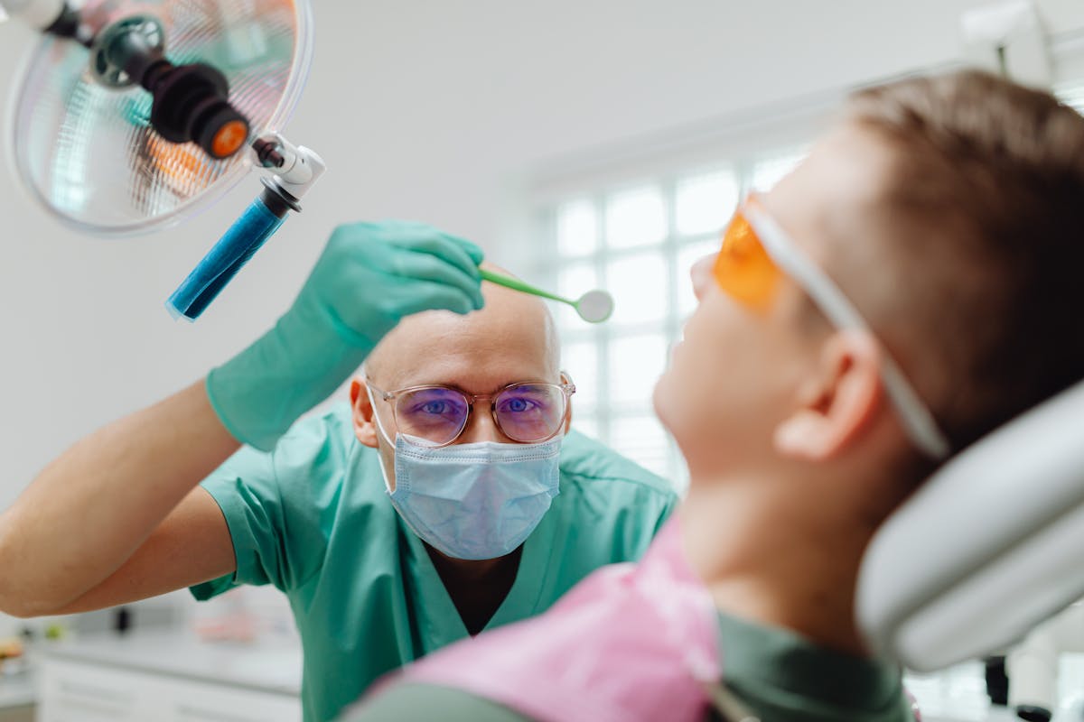 Dentist Diagnosing Patient