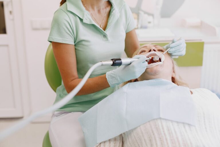 Dentist Treating Womans Teeth