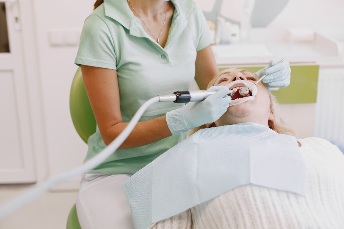 Dentist Treating Womans Teeth