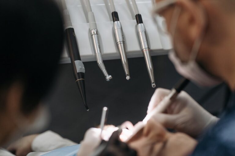 Male Dentist Treating a Patient