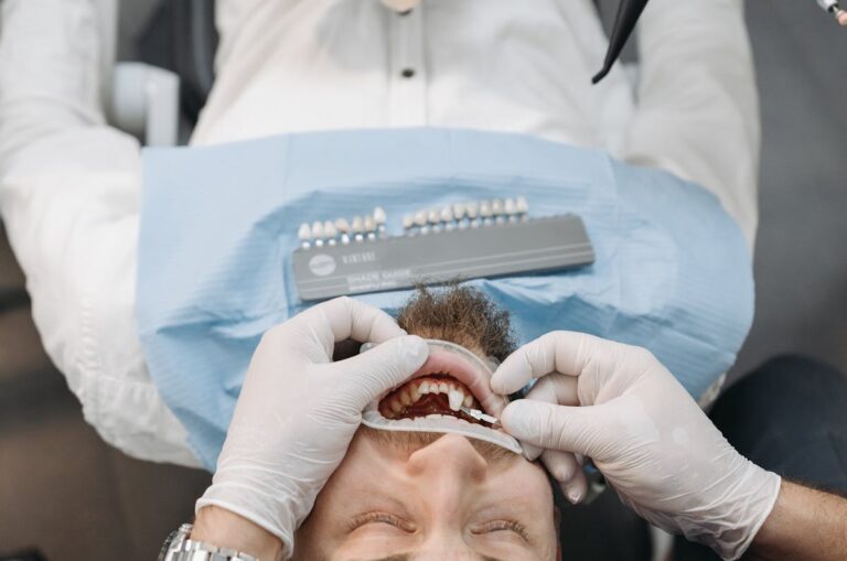 Dentist Hands over Patient Lying Down
